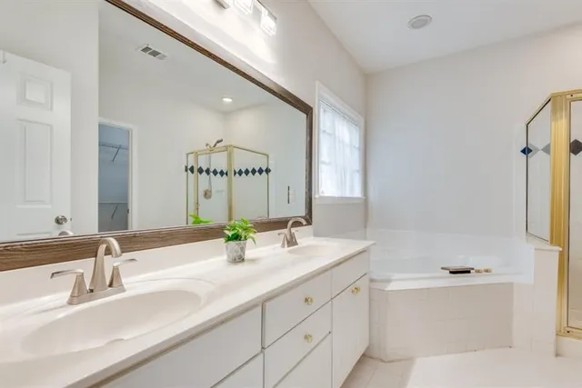 a bathroom with a shower and a tub