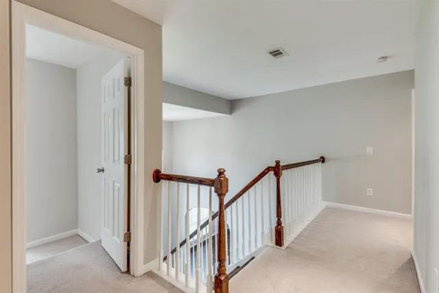 a view of living room with furniture and a fireplace