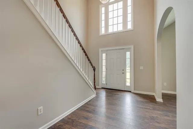 a view of an entryway with wooden floor