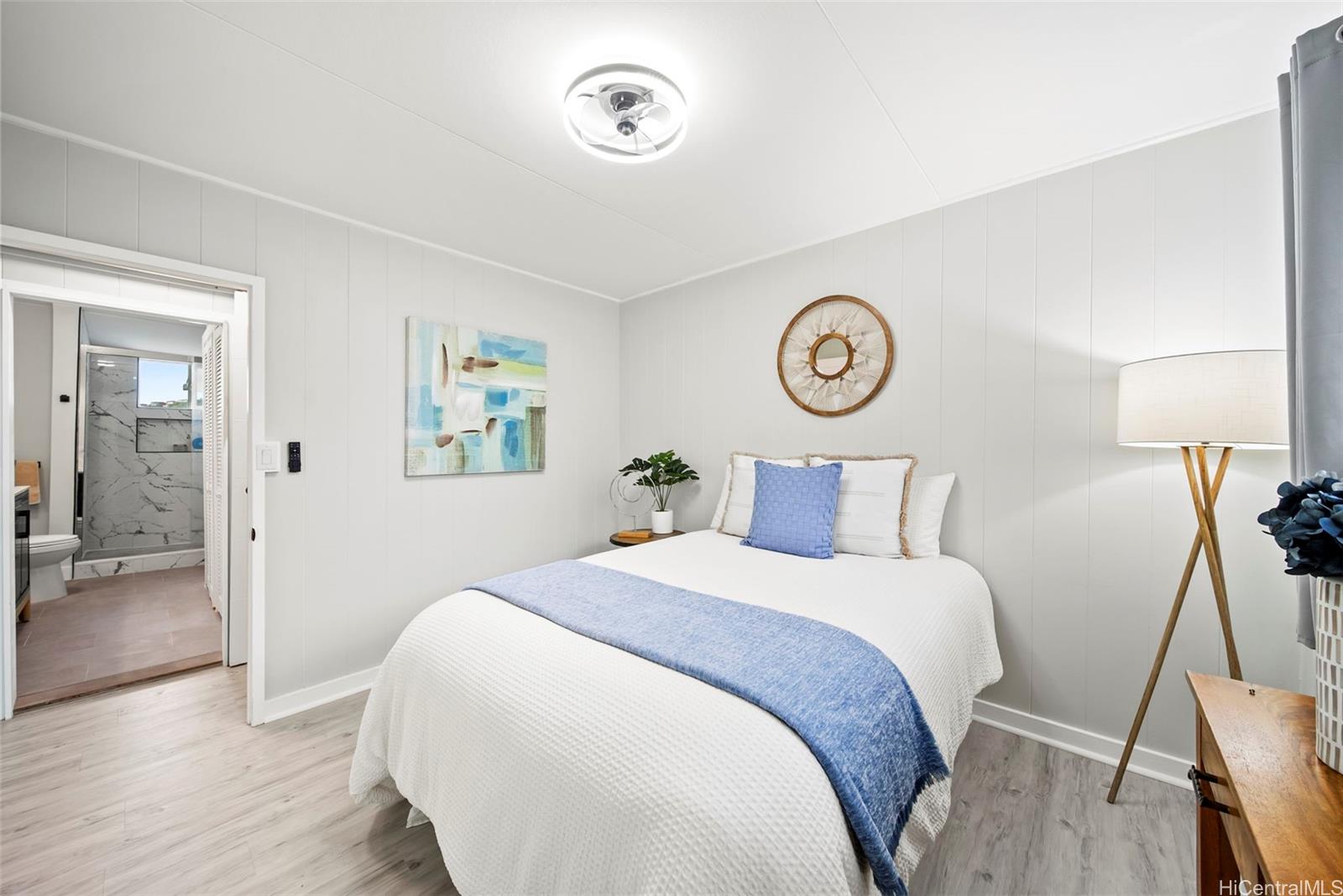 809 Hao Street Honolulu, HI 96821 - Photo 23 of 25 a bedroom with a bed and a table