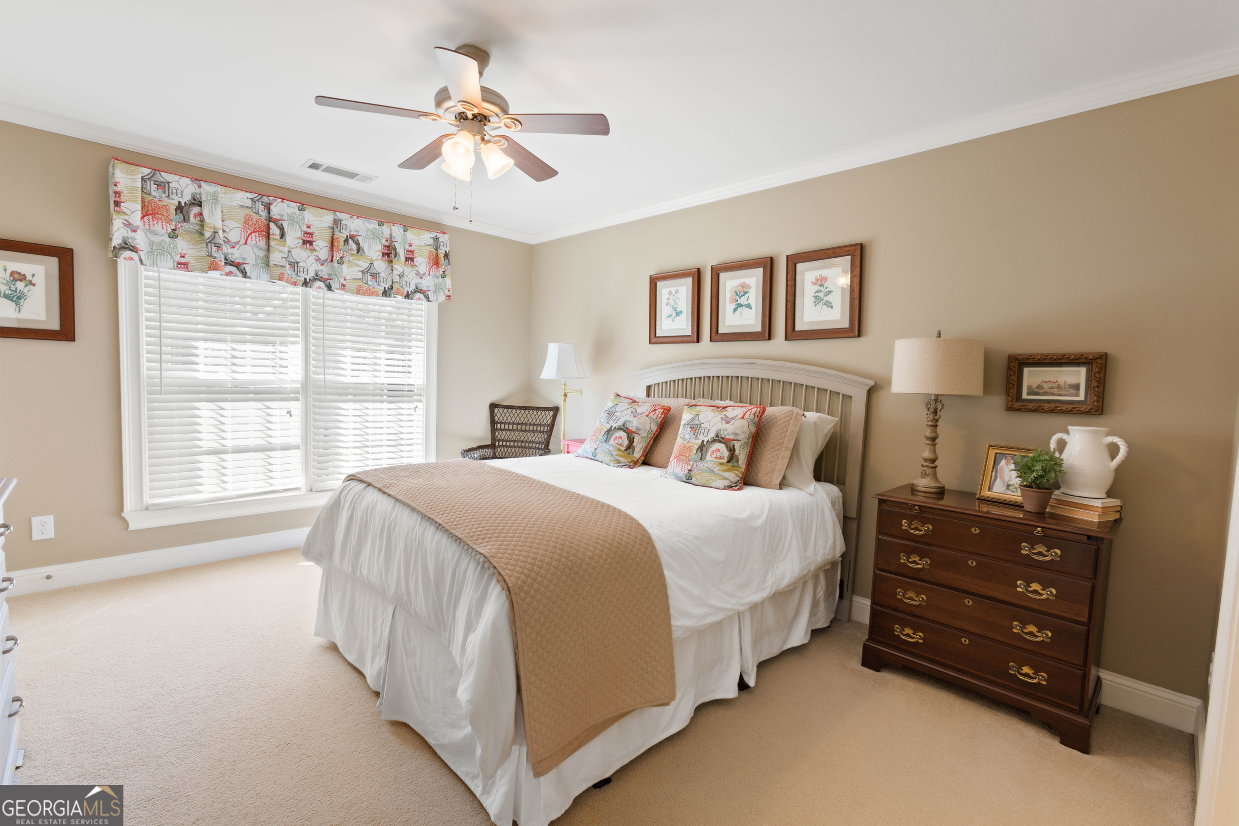 1030 Spring Lake Drive Bishop, GA 30621 - Photo 31 of 53 a spacious bedroom with a bed a window and a chandelier