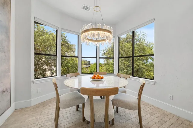 a view of a dining room with furniture window and outside view