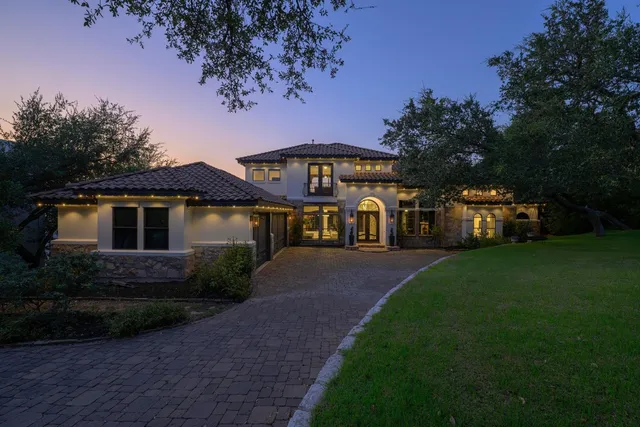 an aerial view of a house with a lake view