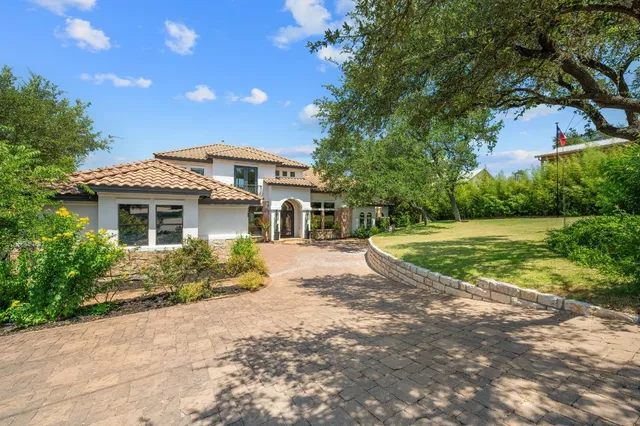 a view of a house with a swimming pool
