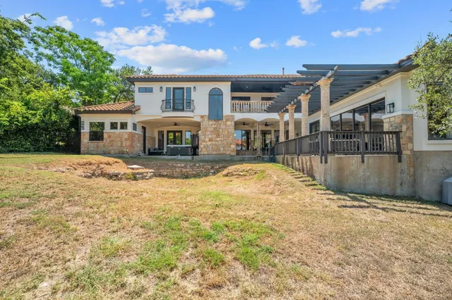 a front view of house with yard barbeque oven and outdoor seating
