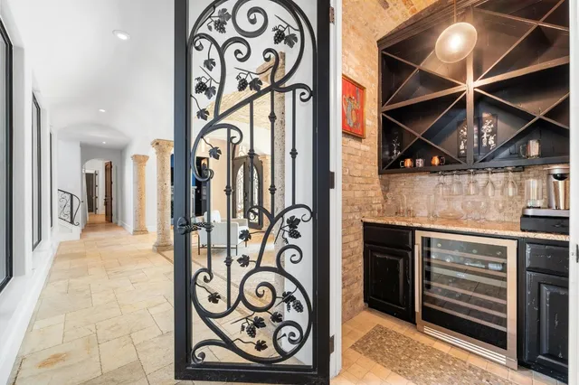a living room with furniture and a glass door