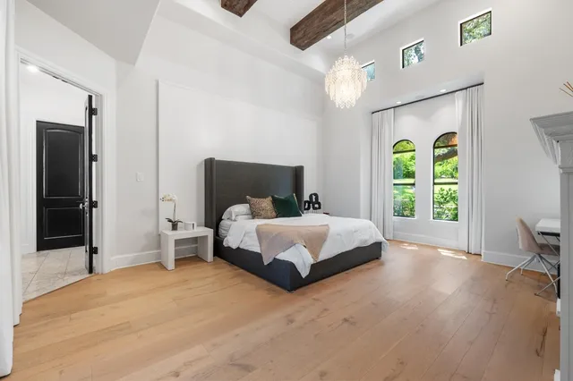 a bedroom with a bed and a fireplace