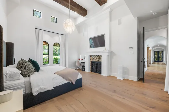 a bathroom with a granite countertop sink mirror and bathtub