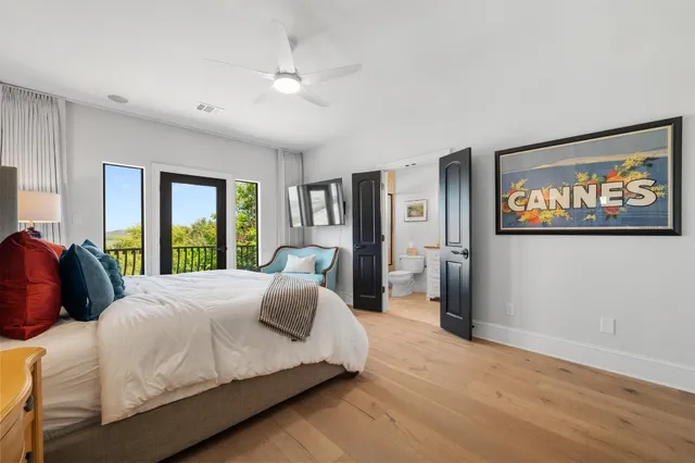 a bedroom with furniture and a window