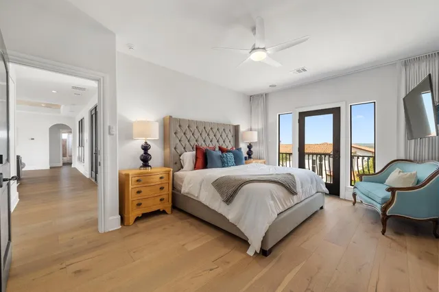 a bedroom with a bed a desk and chair