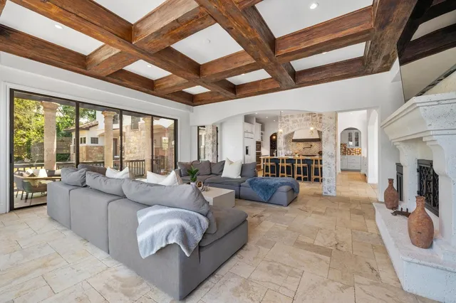 a kitchen with stainless steel appliances granite countertop a stove a sink a oven and a refrigerator