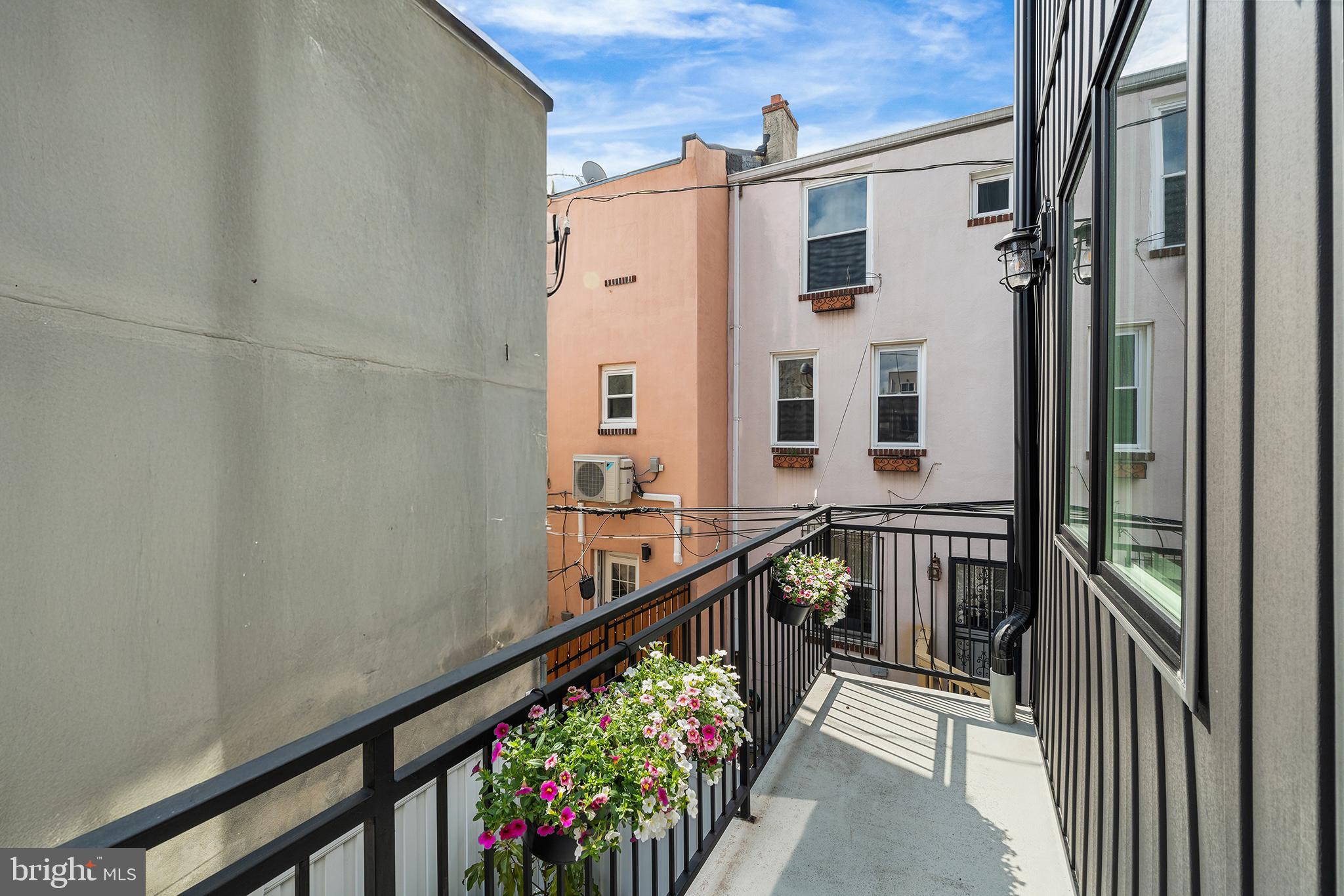 1322 Rodman Street Philadelphia, PA 19147 - Photo 16 of 38 a view of balcony with wooden floor and stairs