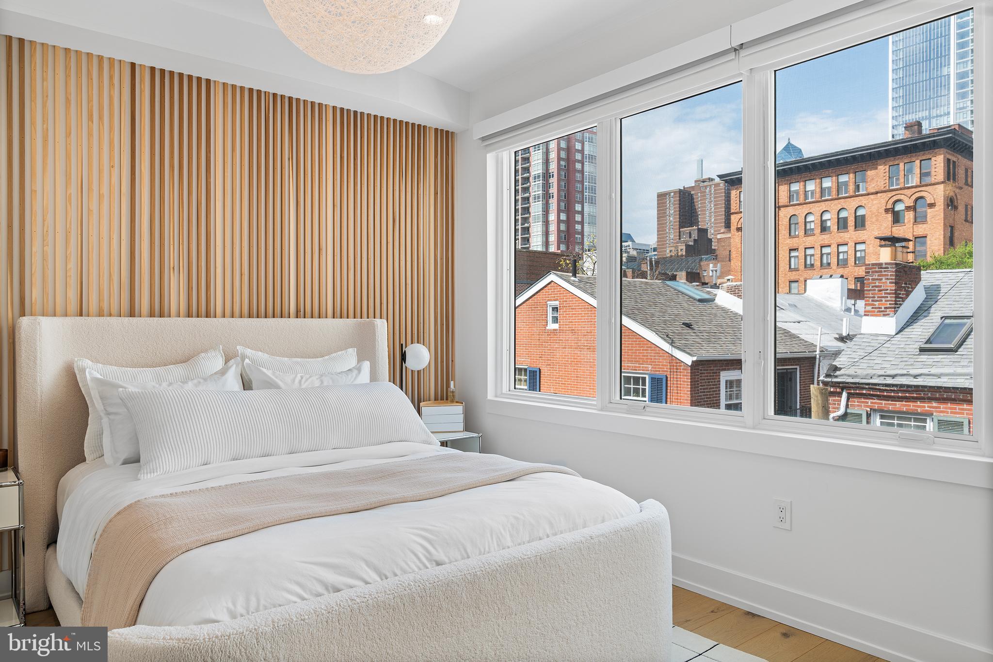 1322 Rodman Street Philadelphia, PA 19147 - Photo 20 of 38 a bedroom with a bed and a window