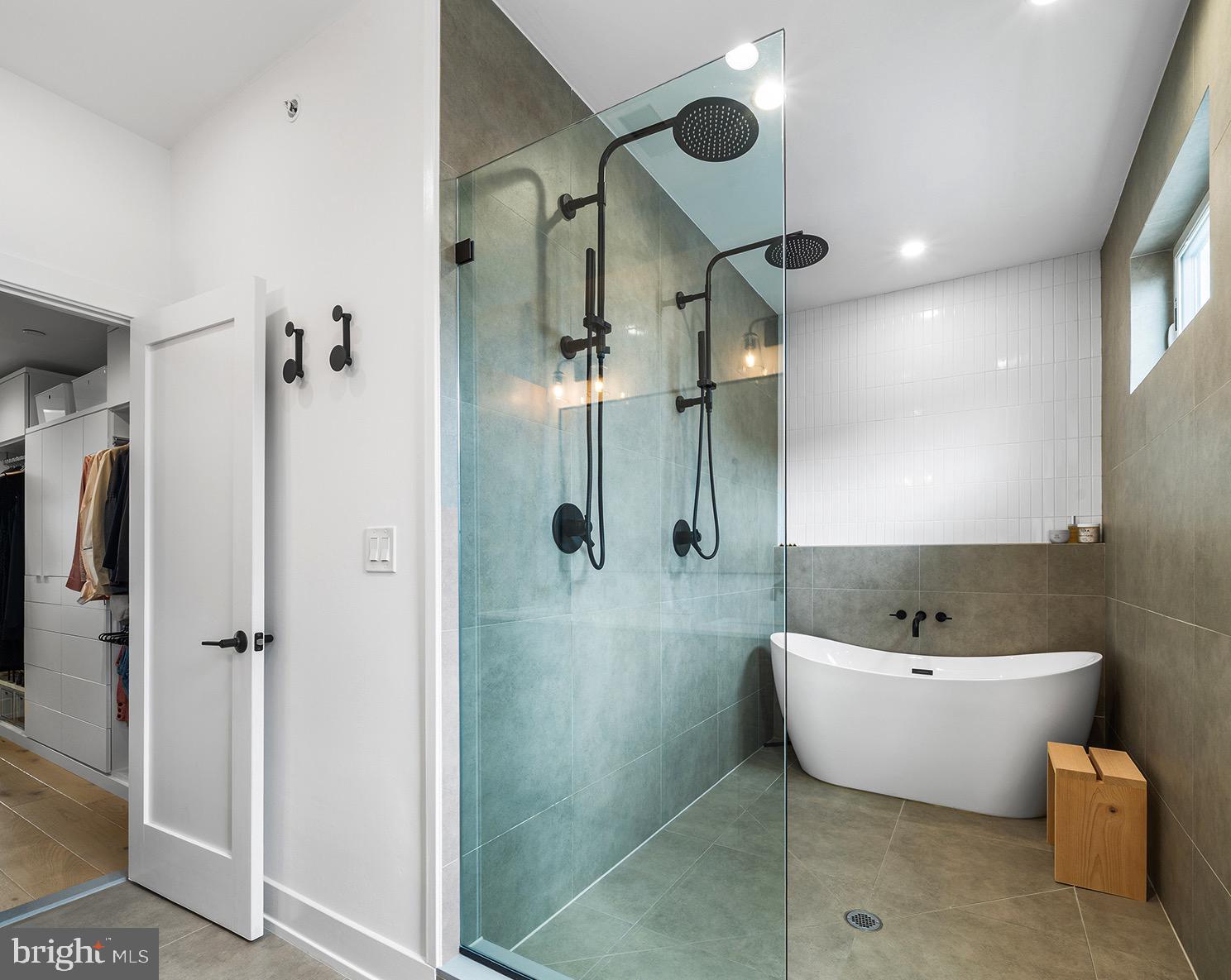 1322 Rodman Street Philadelphia, PA 19147 - Photo 24 of 38 a bathroom with a white tub shower and mirror
