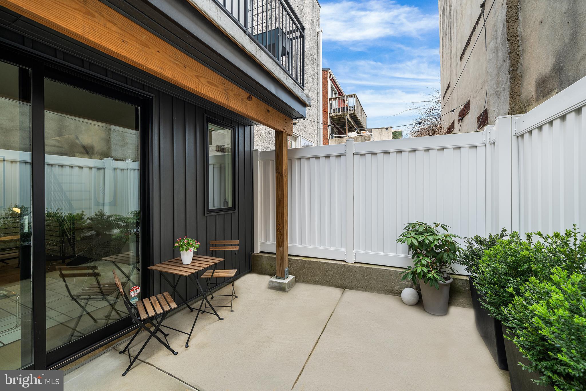 1322 Rodman Street Philadelphia, PA 19147 - Photo 8 of 38 a backyard of a house with outdoor seating