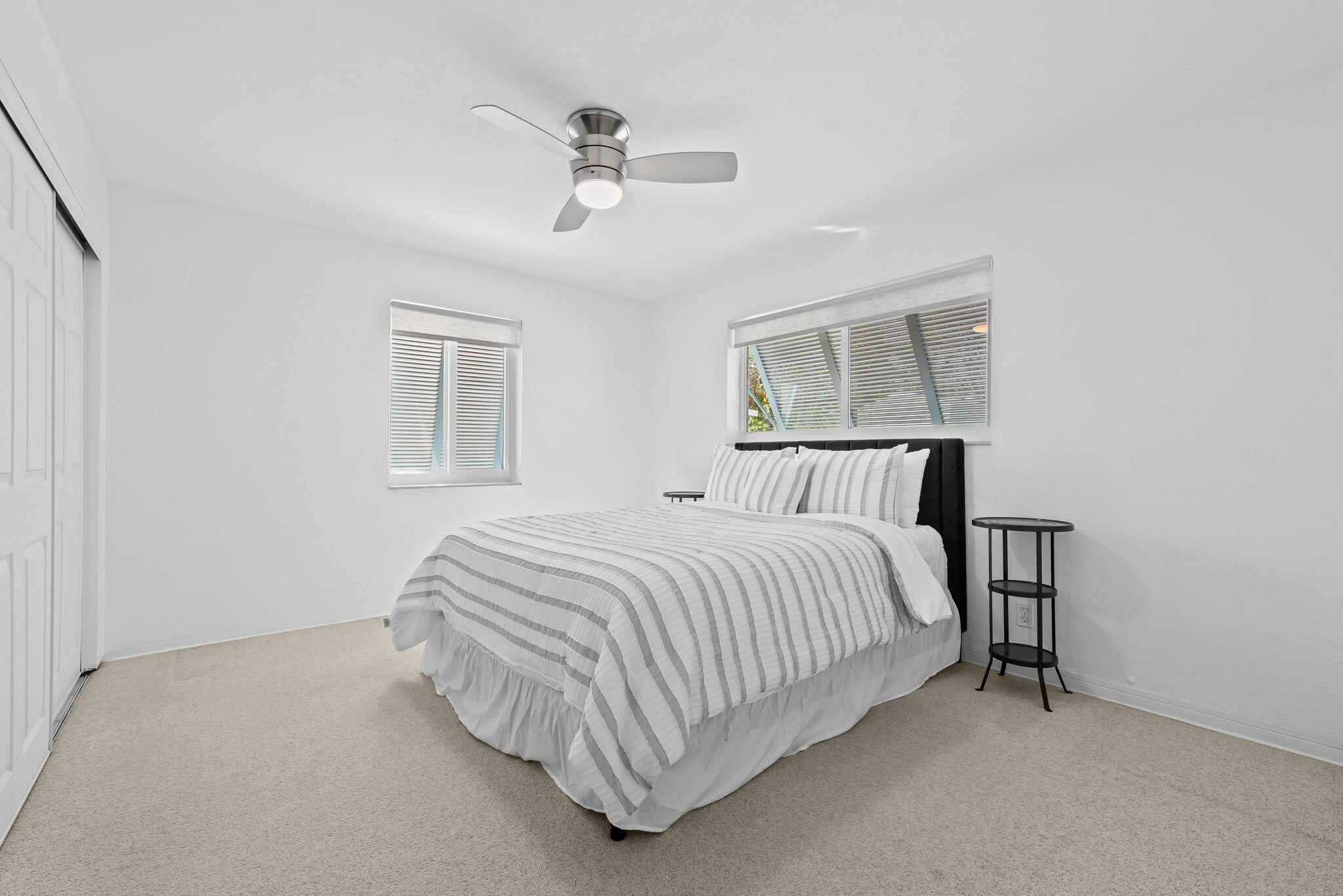 27 Northeast 16th Avenue Pompano Beach, FL 33060 - Photo 11 of 21 a bedroom with a bed and window