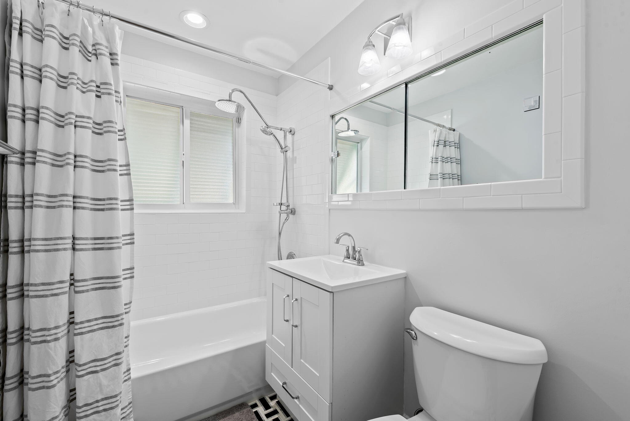 27 Northeast 16th Avenue Pompano Beach, FL 33060 - Photo 13 of 21 a bathroom with a sink a toilet and shower