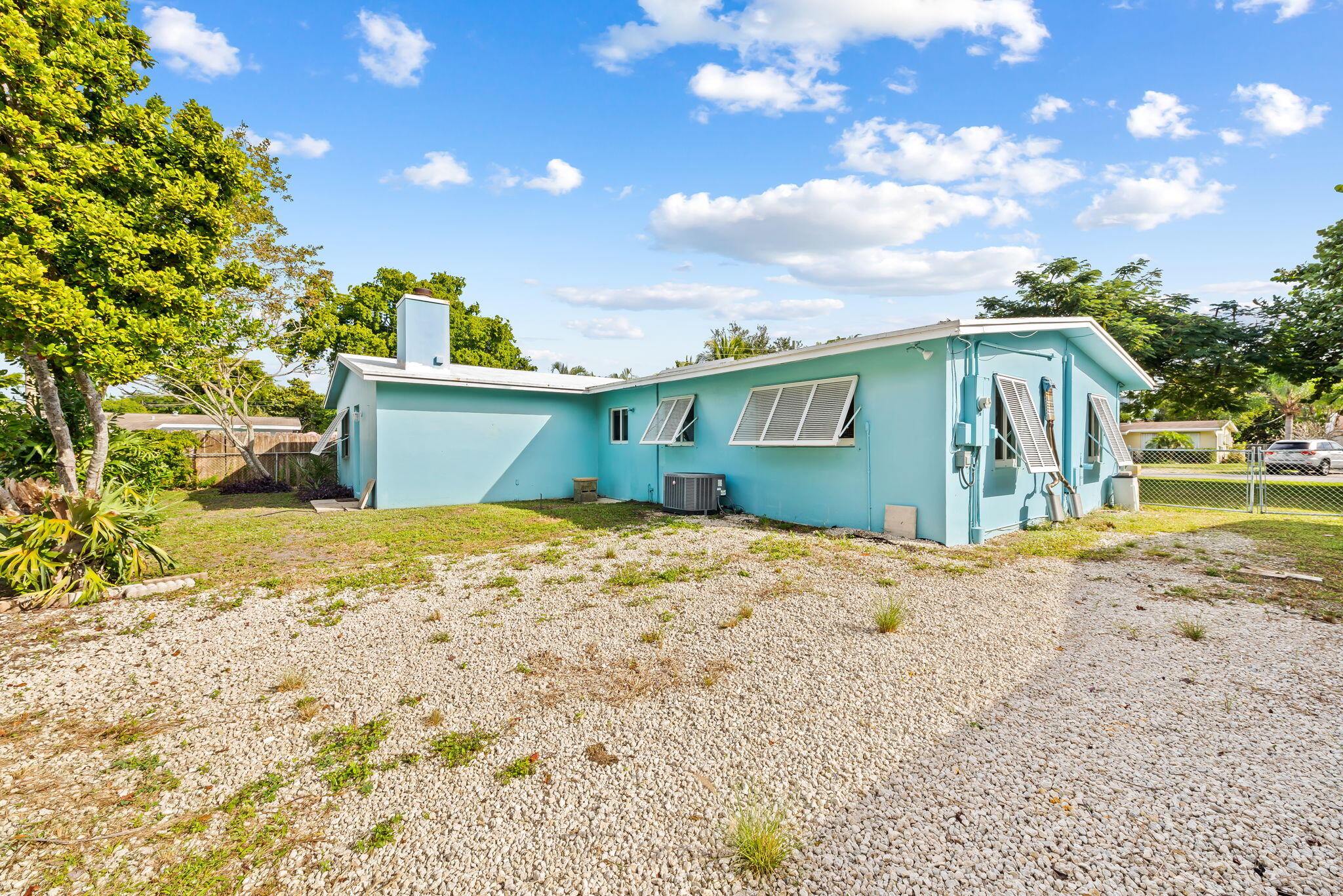 27 Northeast 16th Avenue Pompano Beach, FL 33060 - Photo 20 of 21 a view of a house with a yard and garage