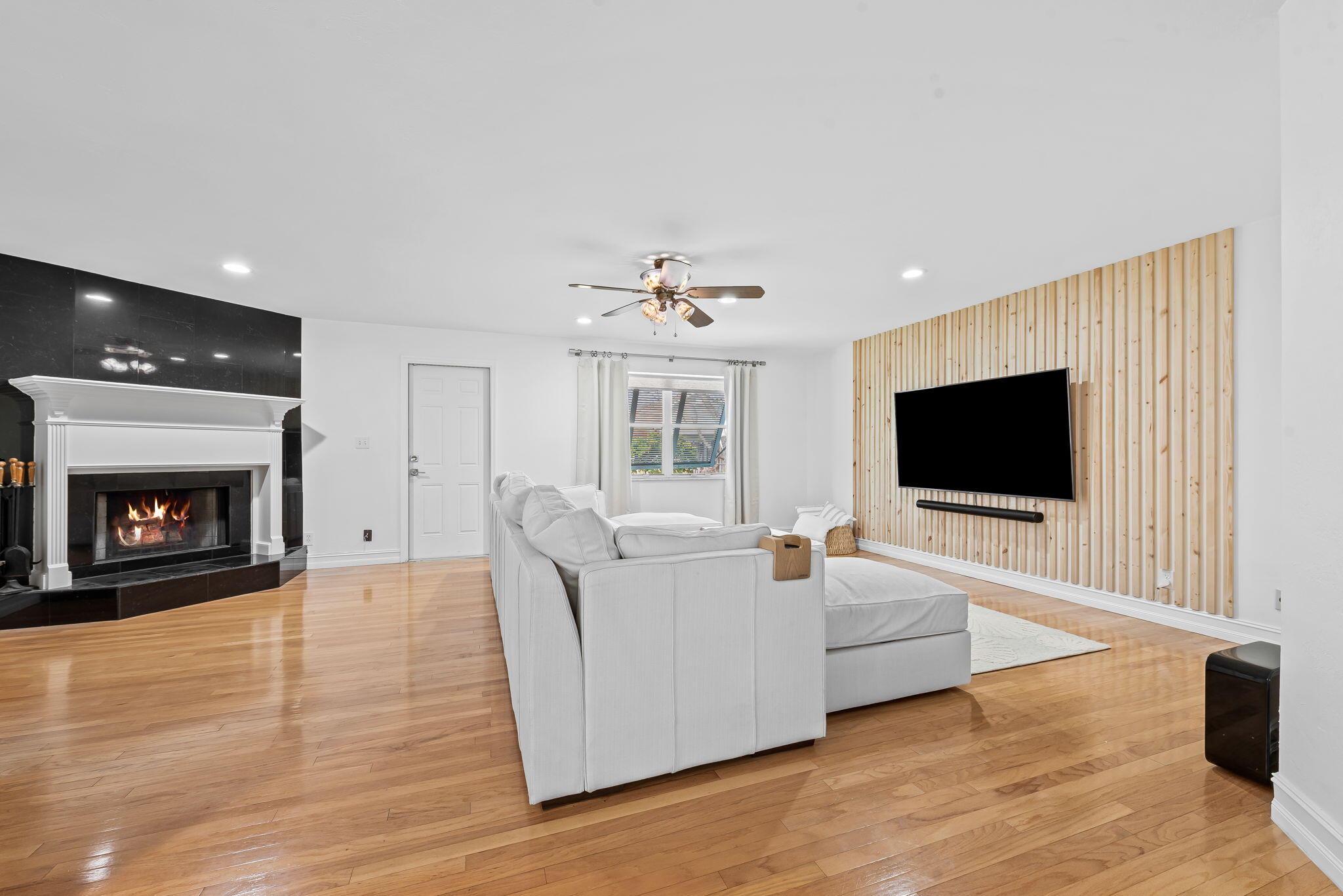 27 Northeast 16th Avenue Pompano Beach, FL 33060 - Photo 7 of 21 a living room with furniture and a flat screen tv