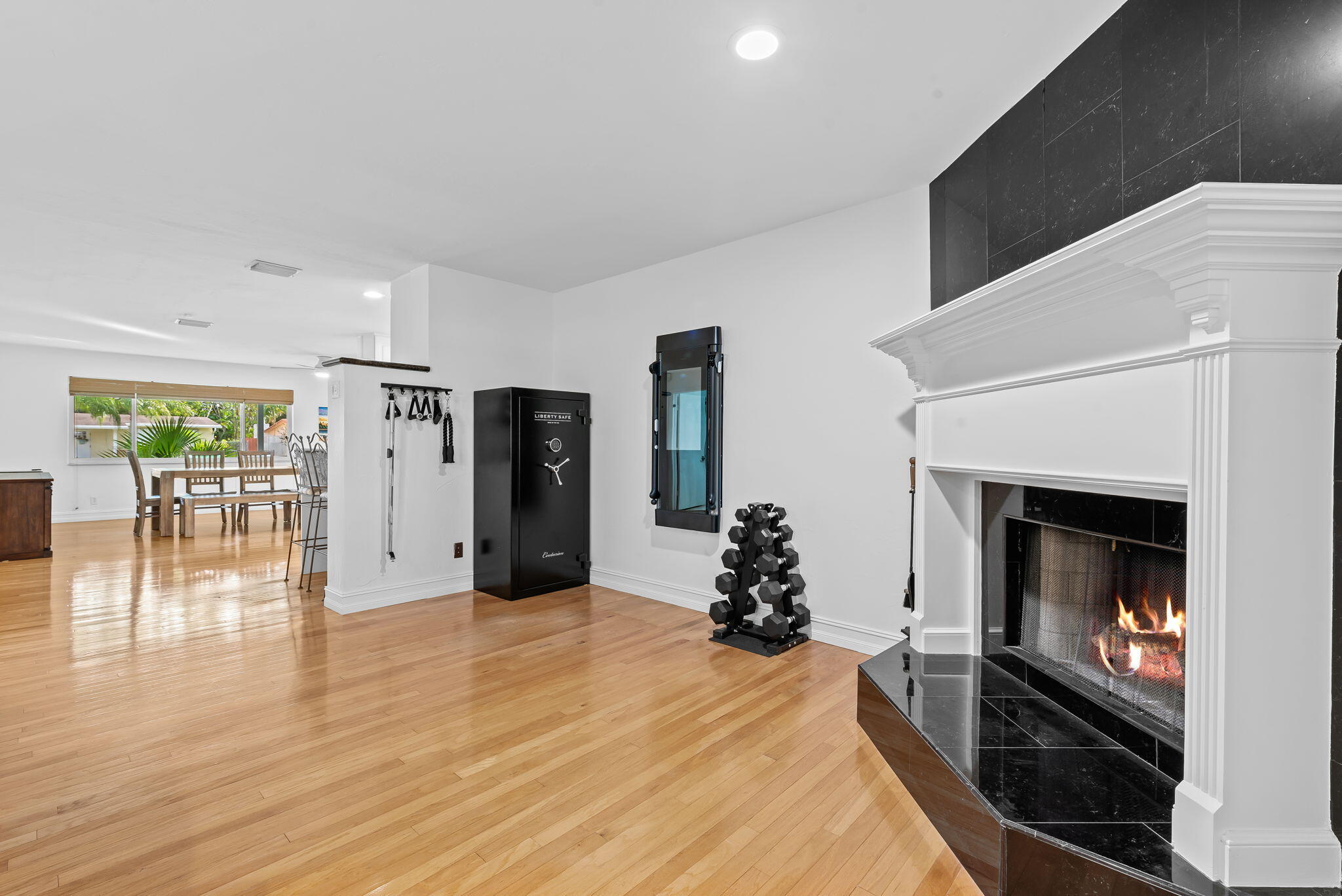 27 Northeast 16th Avenue Pompano Beach, FL 33060 - Photo 8 of 21 a living room with furniture and a fireplace