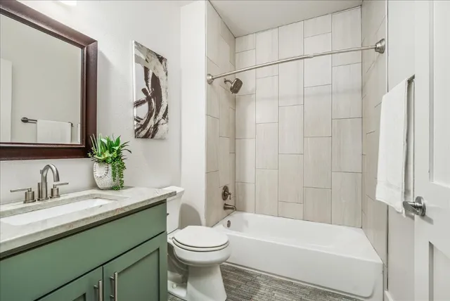 a bathroom with a sink a toilet and a bathtub