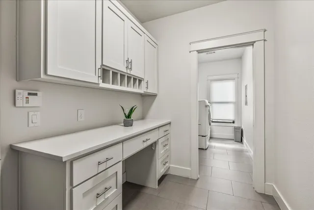 a utility room with cabinets