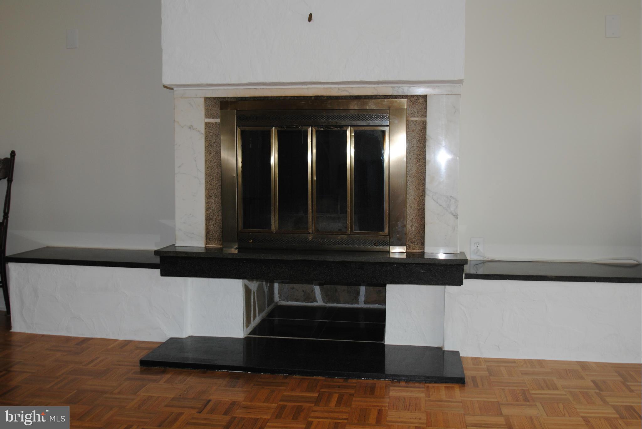 8110 Russell Road Alexandria, VA 22309 - Photo 7 of 29 Raised Fireplace w/ built in seating