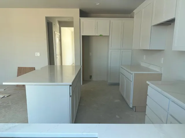 a kitchen with a sink and refrigerator