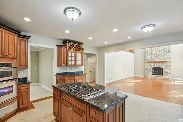 a view of a room with a windows and ceiling fan
