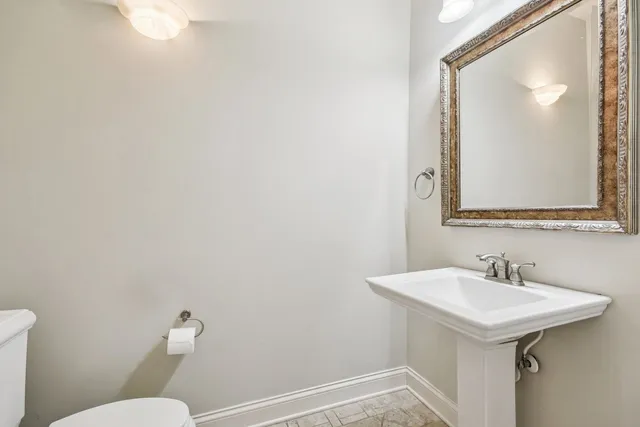 a bathroom with a sink a mirror and a shower