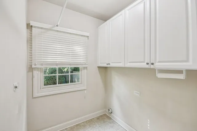a bathroom with a granite countertop sink a toilet a large mirror and shower