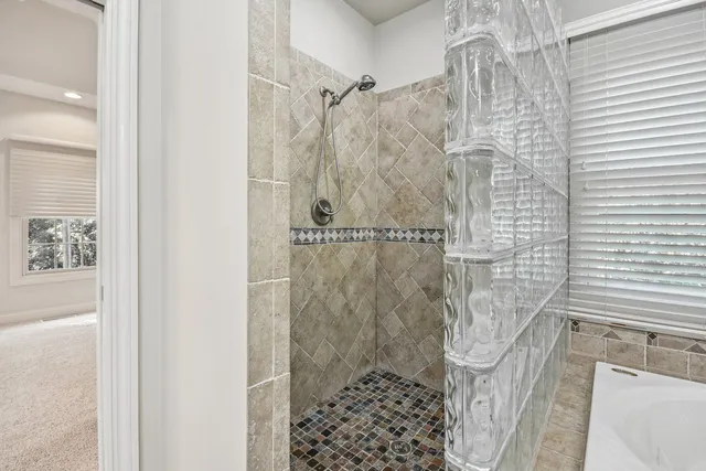 a room with pool table and windows