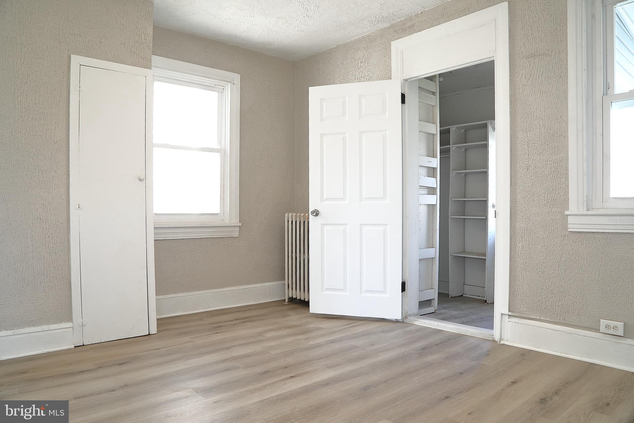875 East Prospect Street York, PA 17403 - Photo 14 of 21 an empty room with wooden floor and windows