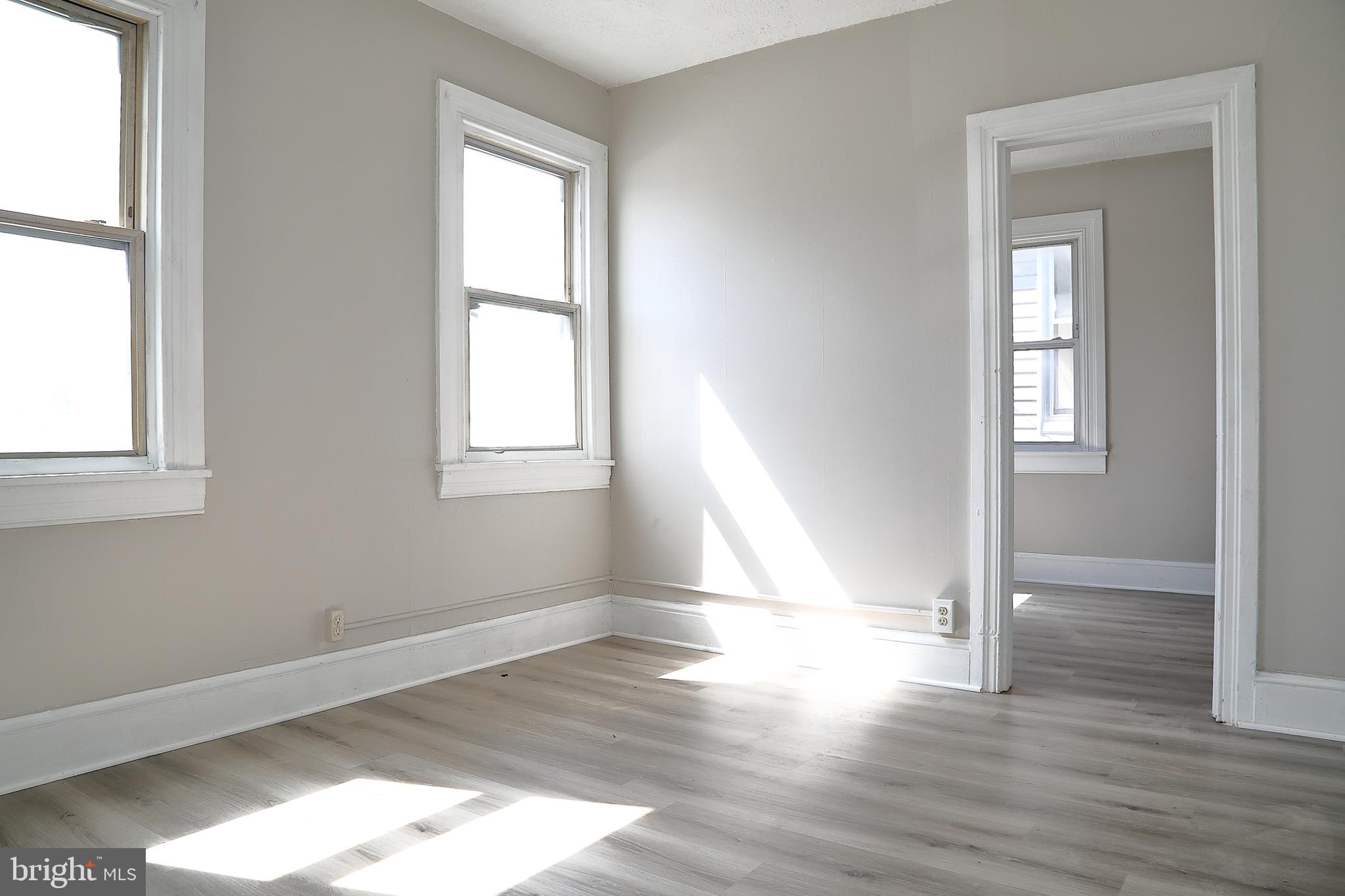 875 East Prospect Street York, PA 17403 - Photo 17 of 21 an empty room with wooden floor and windows