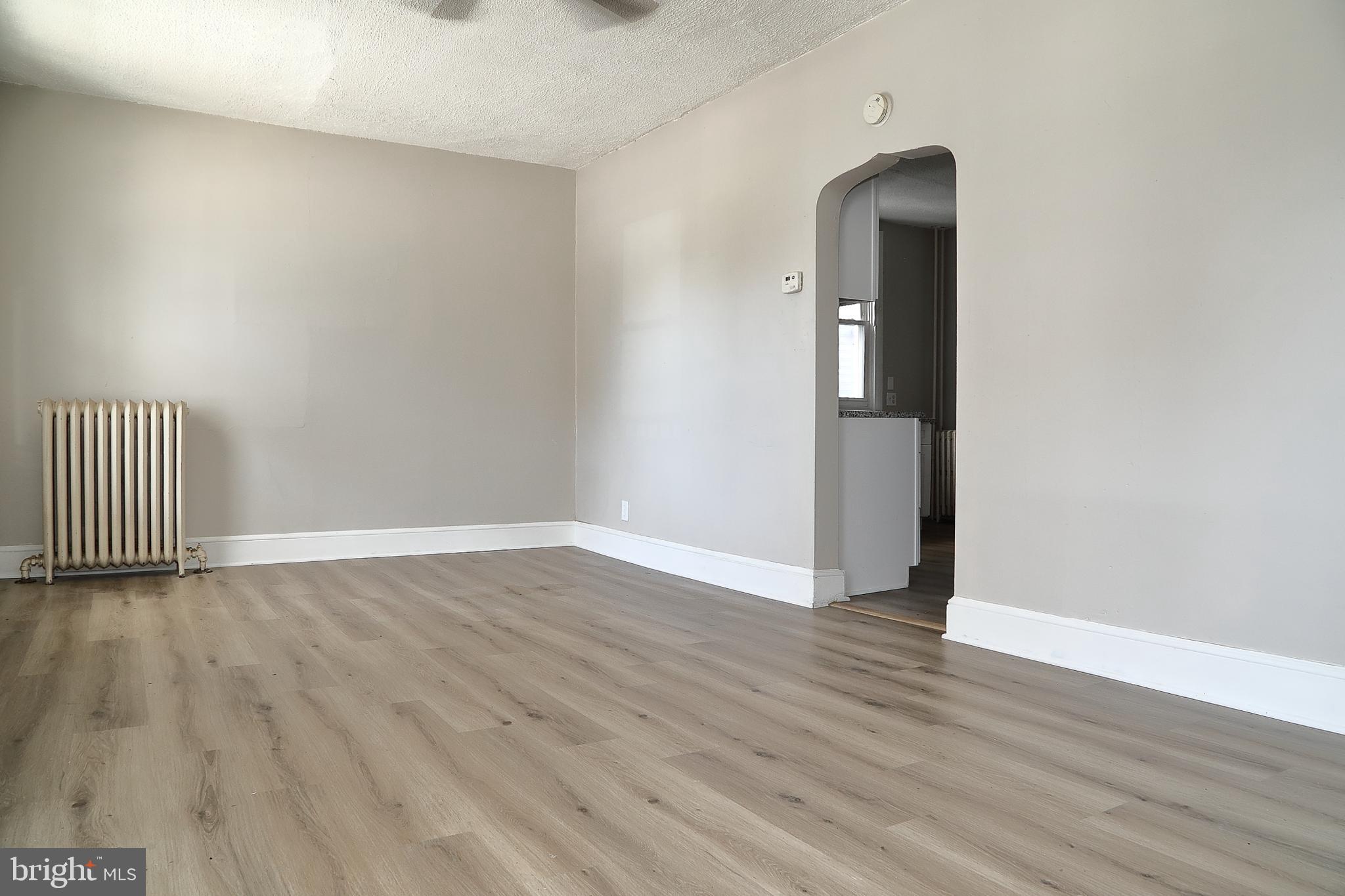 875 East Prospect Street York, PA 17403 - Photo 3 of 21 an empty room with wooden floor and closet