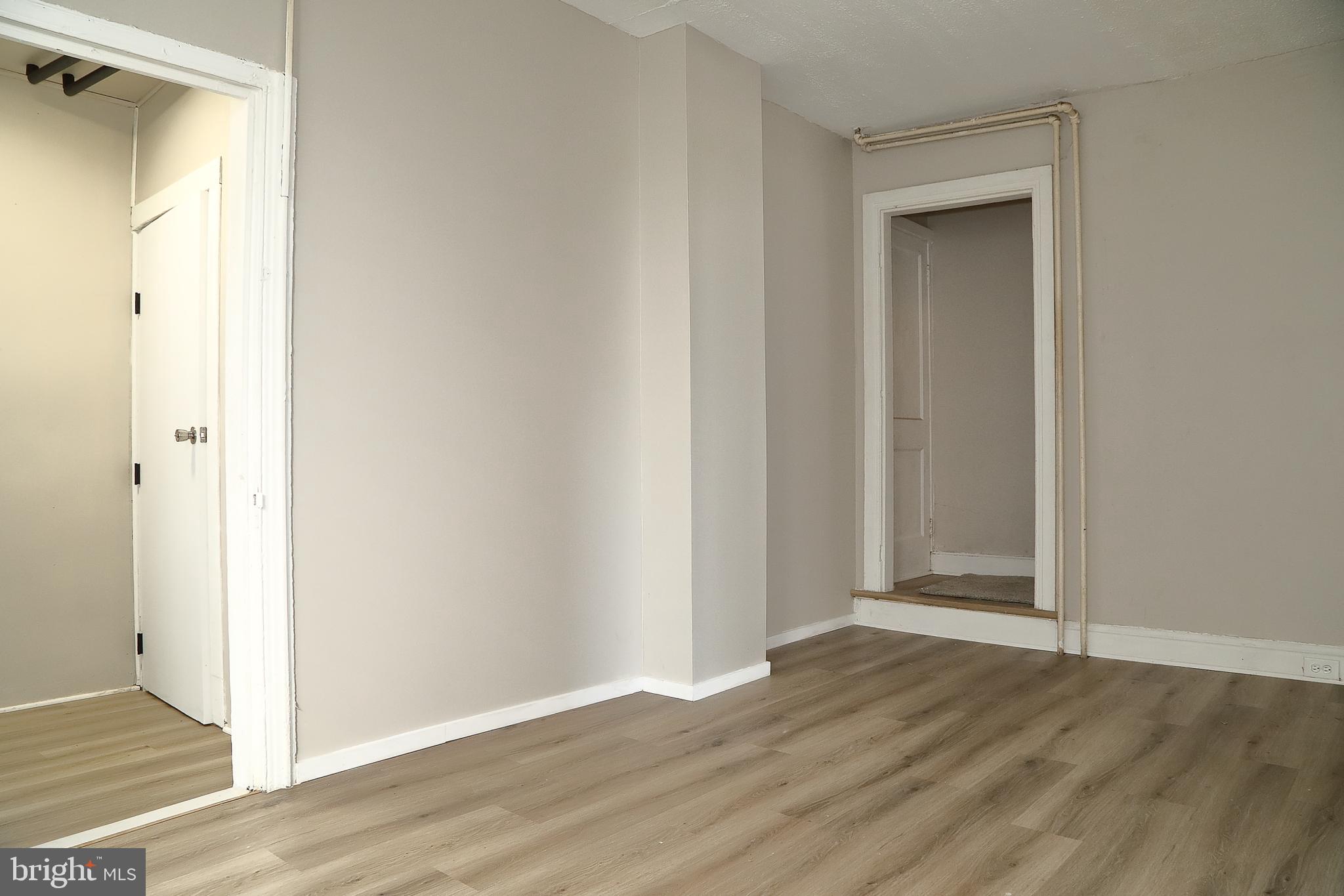 875 East Prospect Street York, PA 17403 - Photo 7 of 21 a view of an empty room with wooden floor and closet