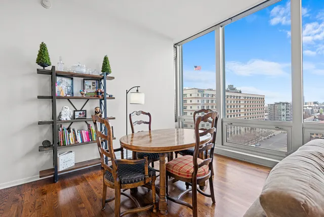 a view of a livingroom with furniture and a book shelf