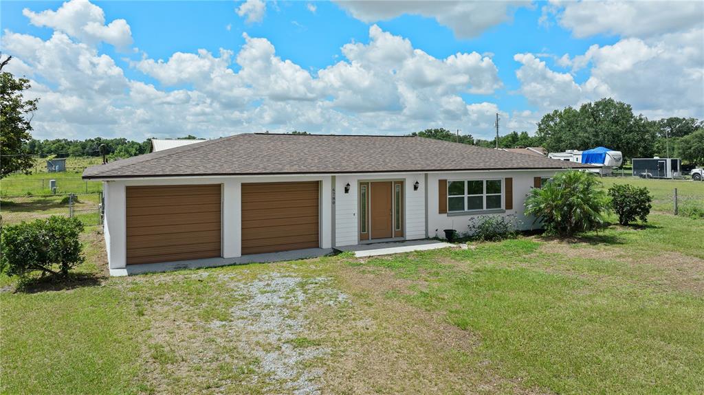 front view of a house with a yard