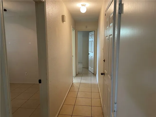 view of an empty room with mirror