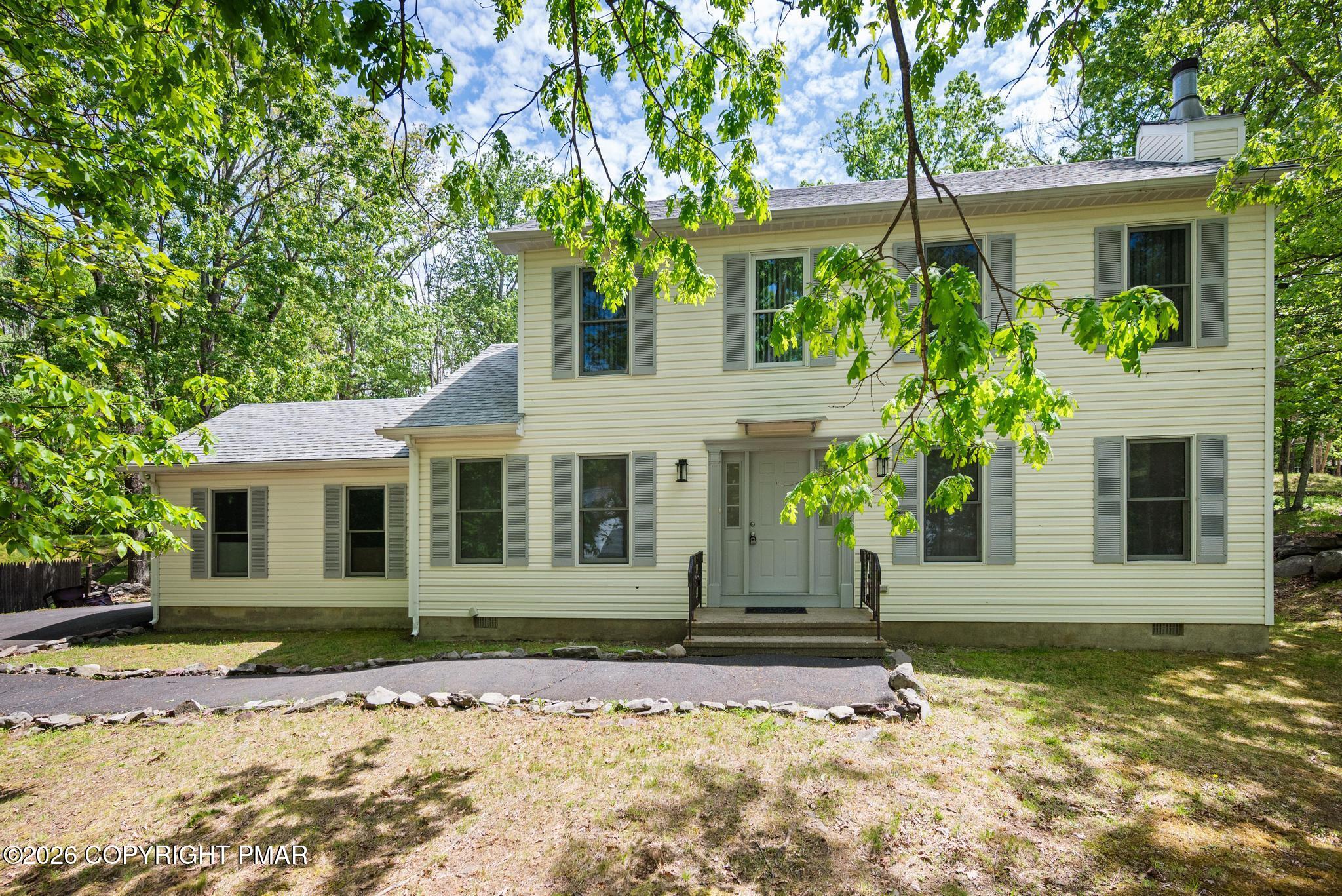 2312 Cramer Court Bushkill, PA 18324 - Photo 2 of 37 a front view of a house with garden