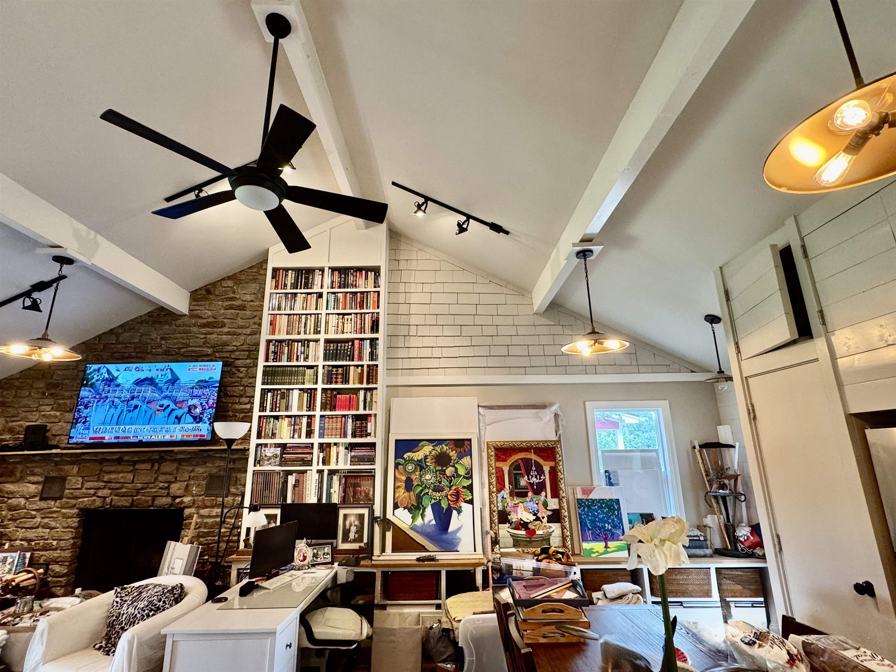 402 Laurel Lane Burnet, TX 78611 - Photo 13 of 30 a living room with furniture a fireplace and a flat screen tv