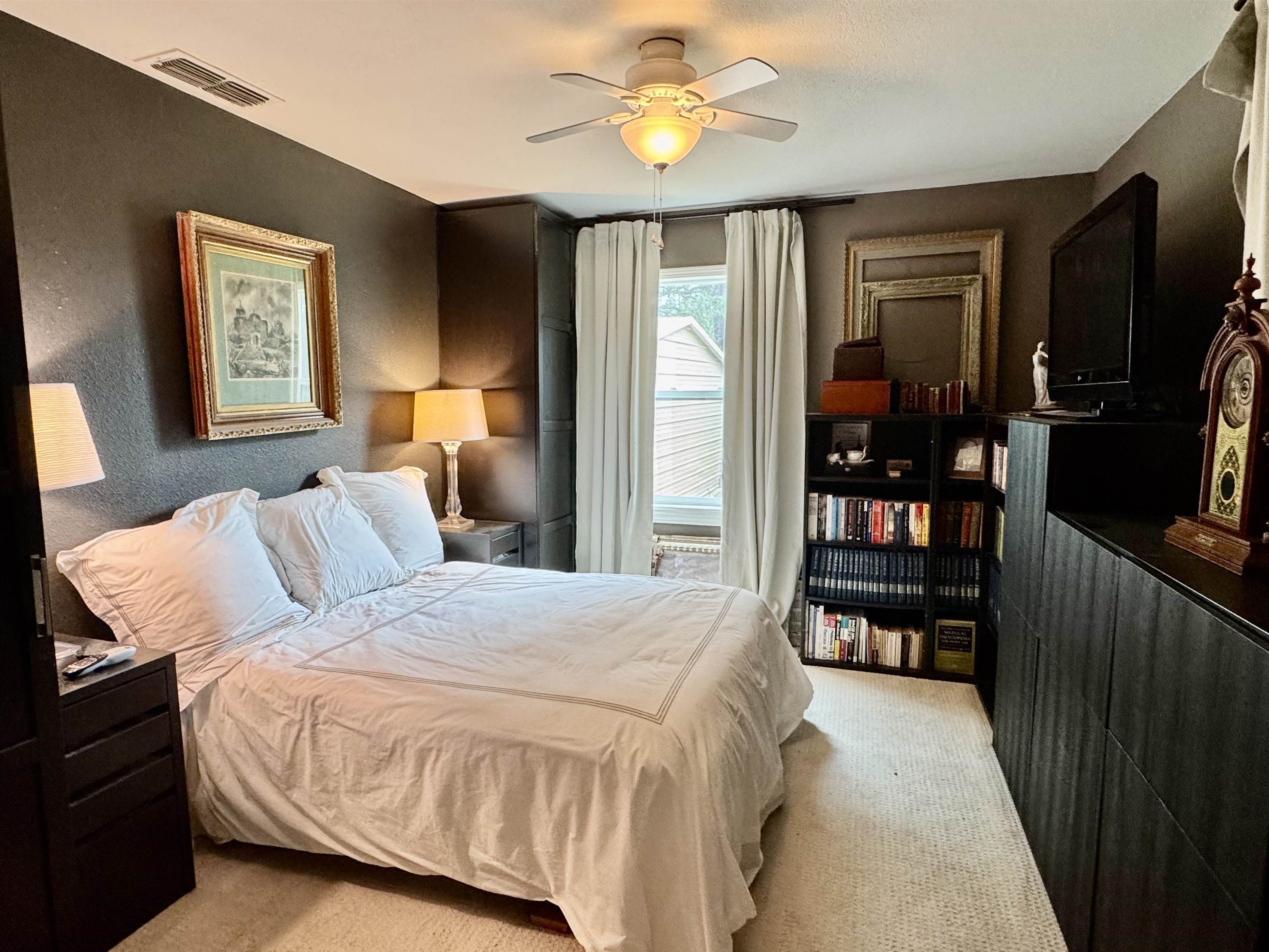 402 Laurel Lane Burnet, TX 78611 - Photo 19 of 30 a bedroom with a bed furniture and a window