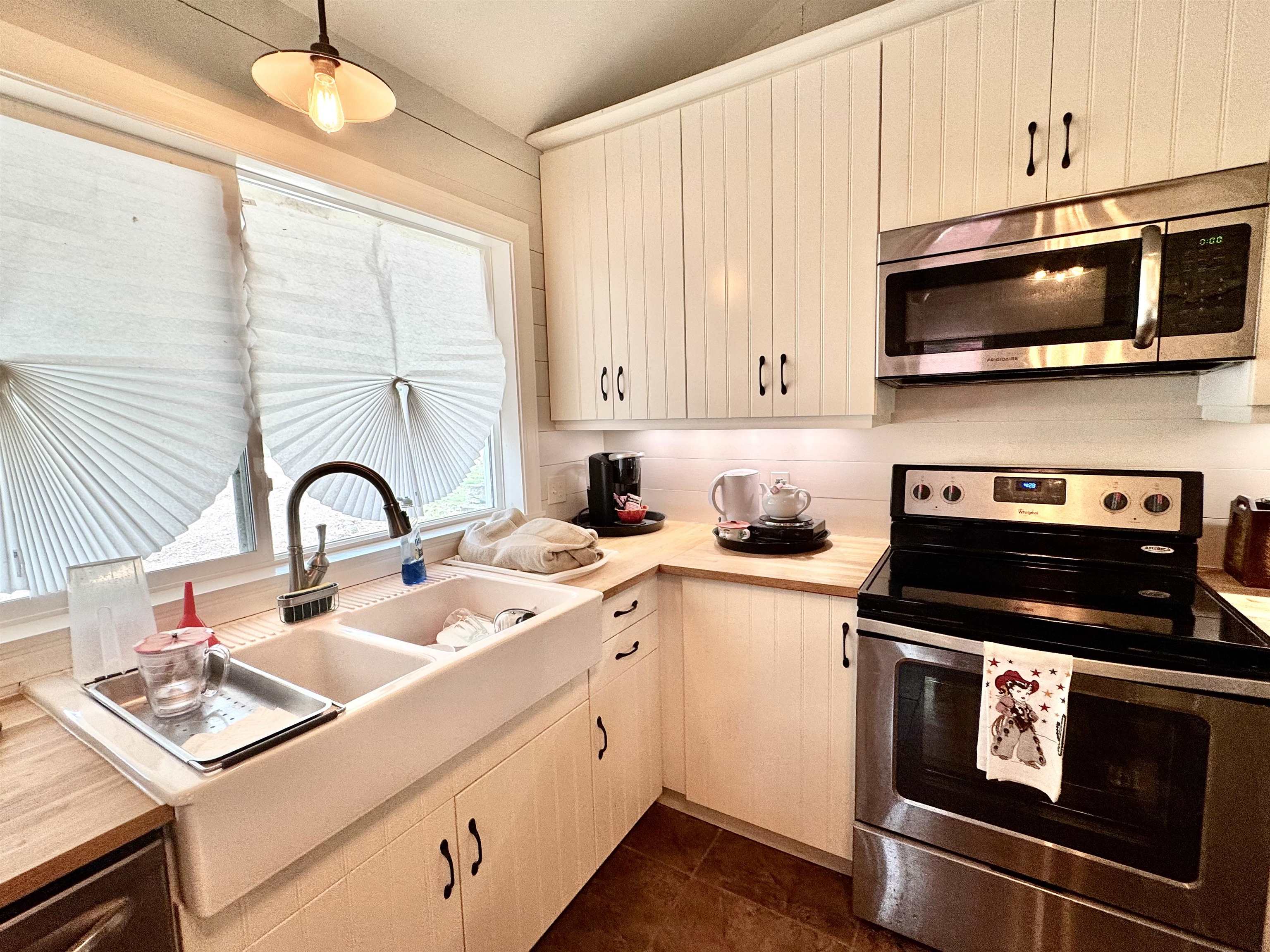 402 Laurel Lane Burnet, TX 78611 - Photo 3 of 30 a kitchen with stainless steel appliances granite countertop a sink and a stove