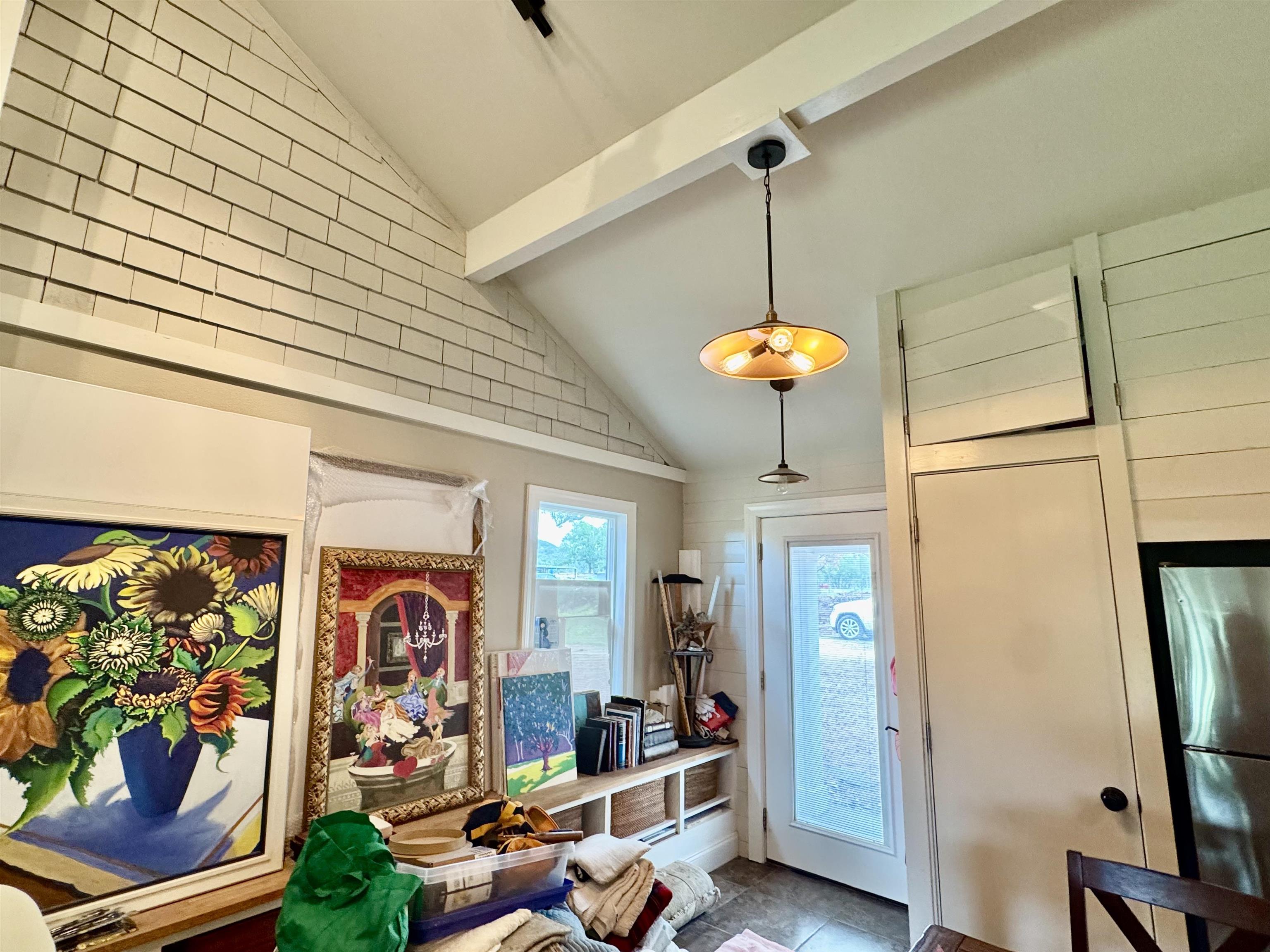 402 Laurel Lane Burnet, TX 78611 - Photo 6 of 30 a dining room filled with furniture and a chandelier
