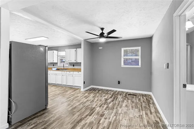 a view of kitchen with wooden floor