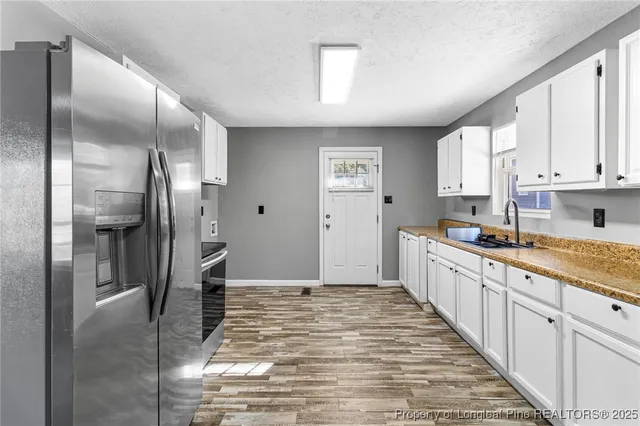 a large kitchen with cabinets