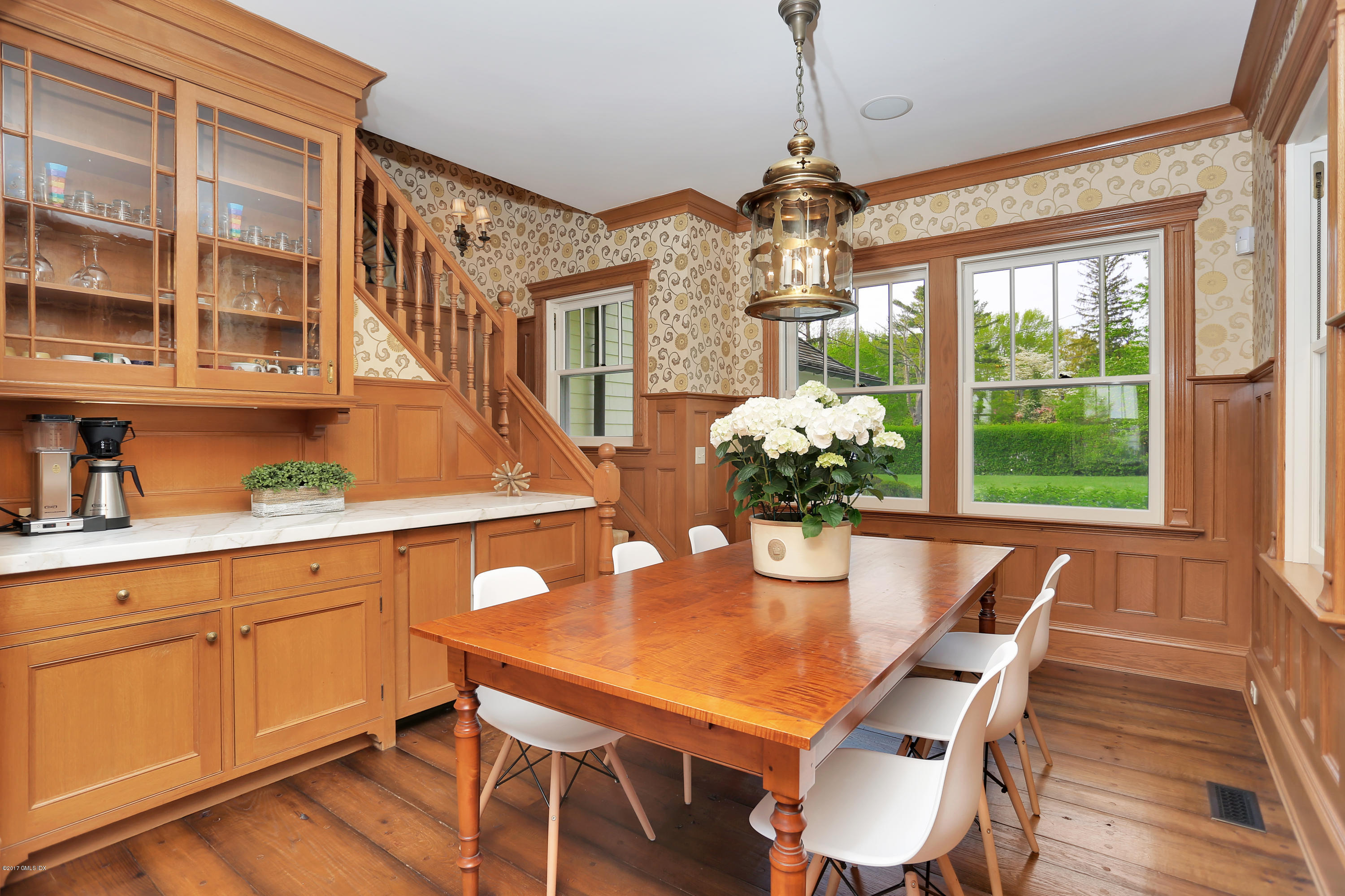96 Club Road Riverside, CT 06878 - Photo 13 of 33 a dining room with furniture a chandelier and wooden floor