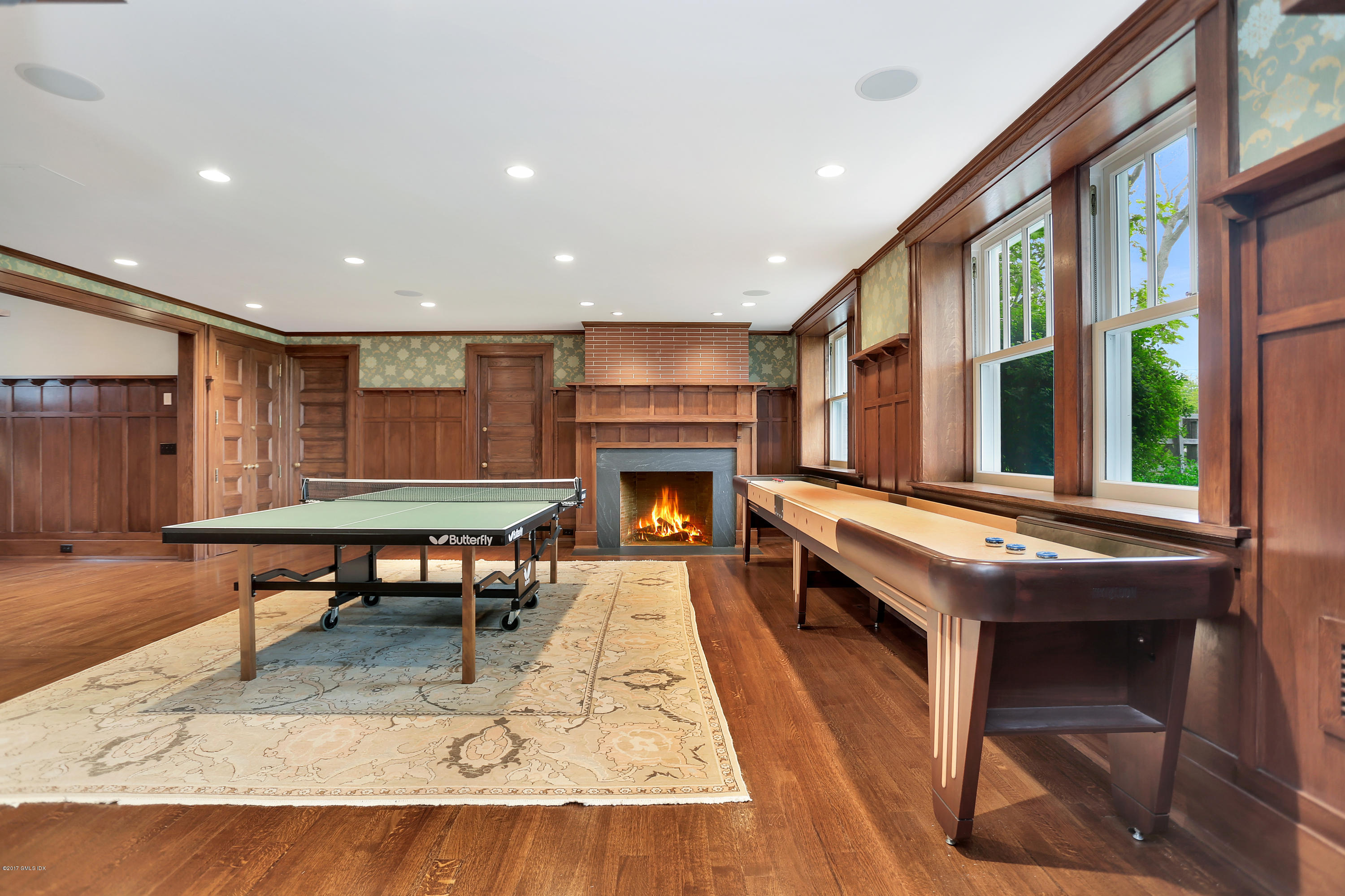 96 Club Road Riverside, CT 06878 - Photo 23 of 33 a living room with furniture a table and a fireplace