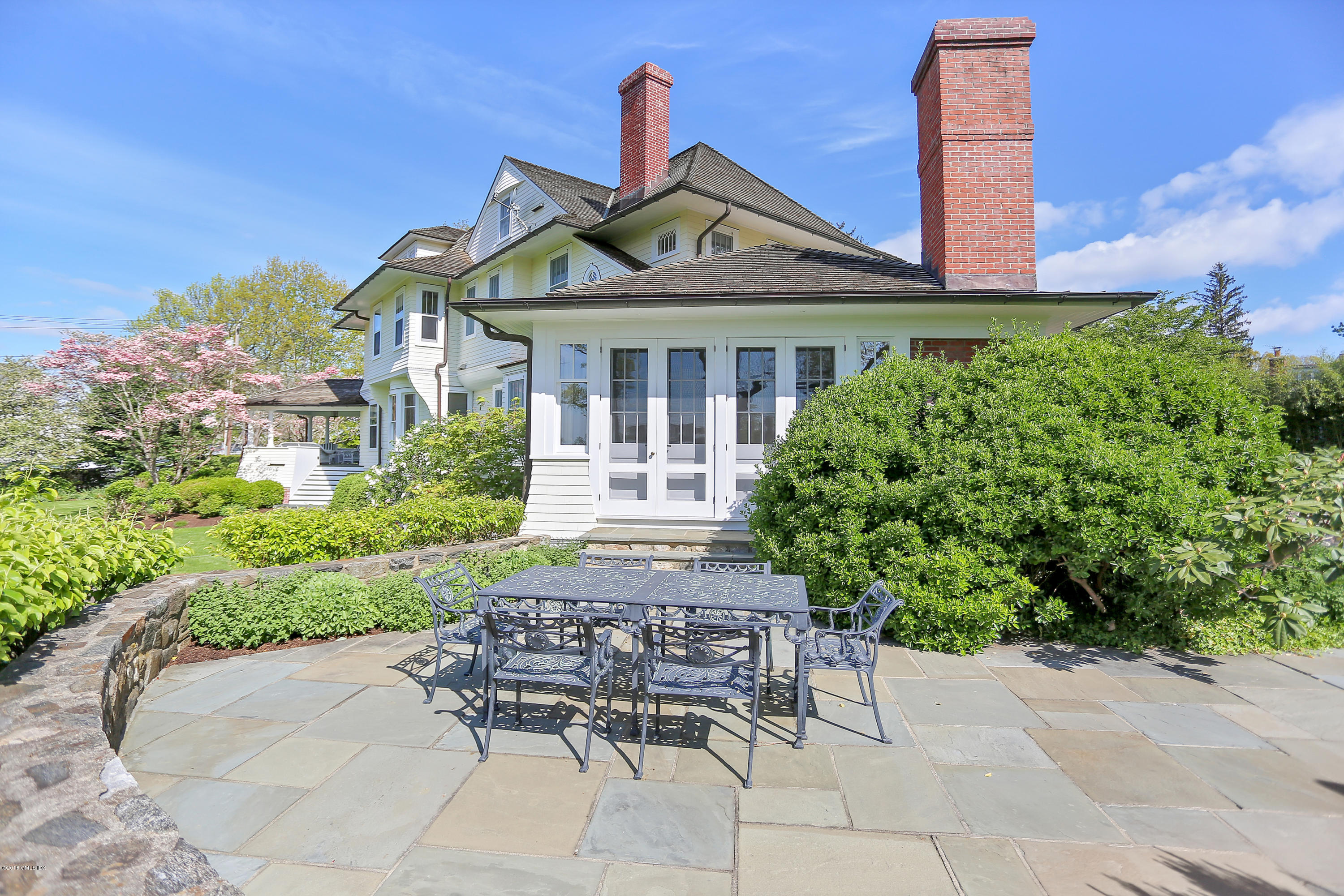 96 Club Road Riverside, CT 06878 - Photo 26 of 33 a front view of a house with garden