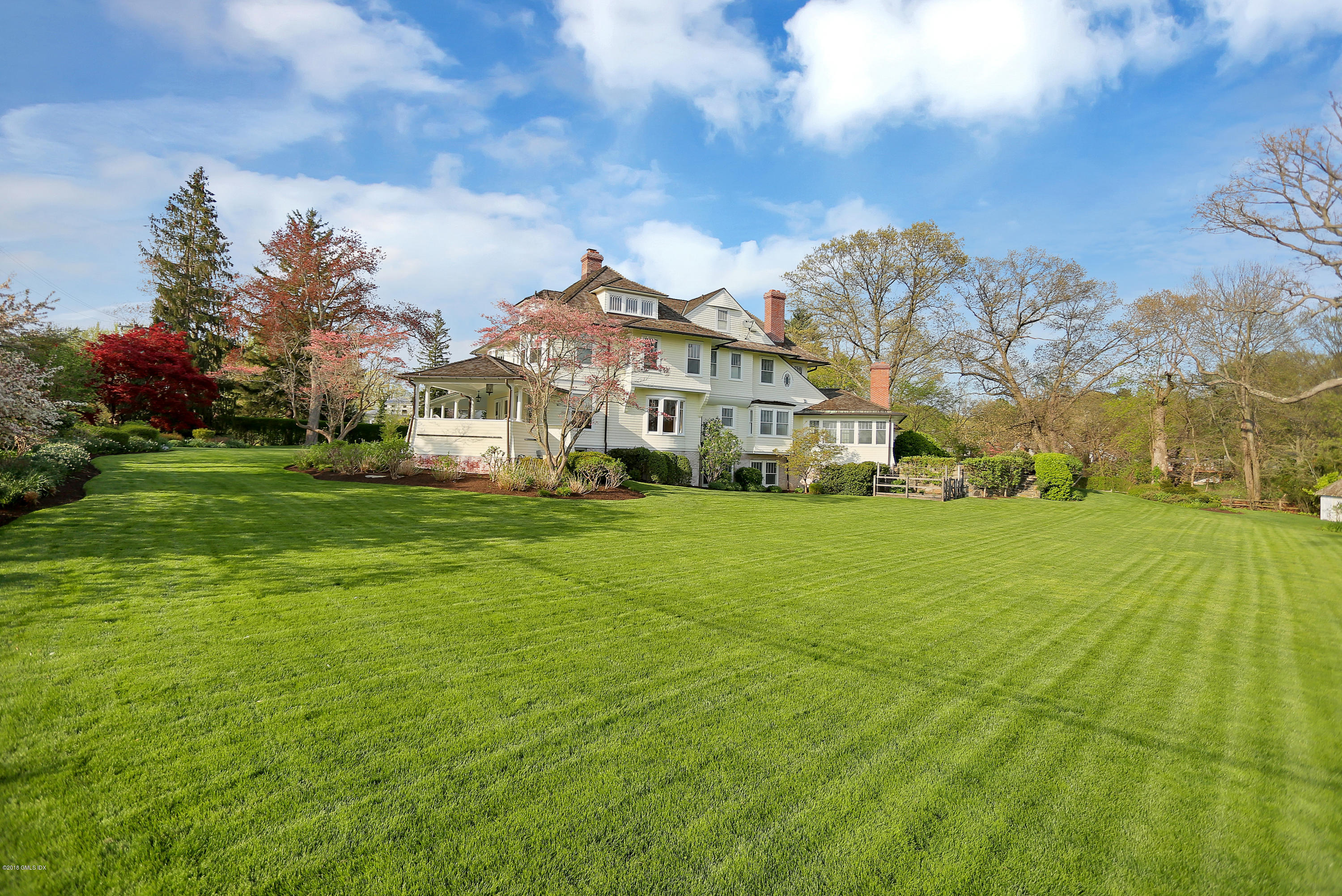 96 Club Road Riverside, CT 06878 - Photo 29 of 33 a view of a white house with a big yard plants and large trees